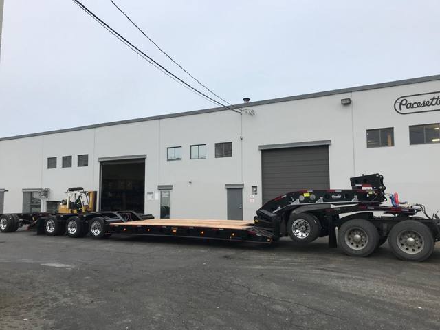 Black 55 ton lowbed with red pinstriping and a single axle pin-on booster at the Pacesetter yard, photo 7 of 14
