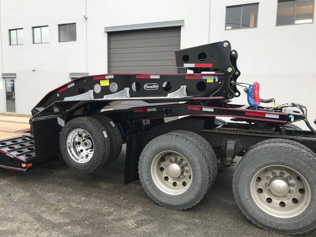 Black 55 ton lowbed with red pinstriping and a single axle pin-on booster at the Pacesetter yard, photo 10 of 14