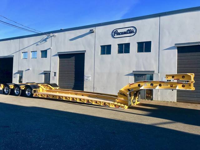 Yellow 60 ton lowbed with black fenders and a pin-on booster at the Pacesetter yard, photo 1 of 11