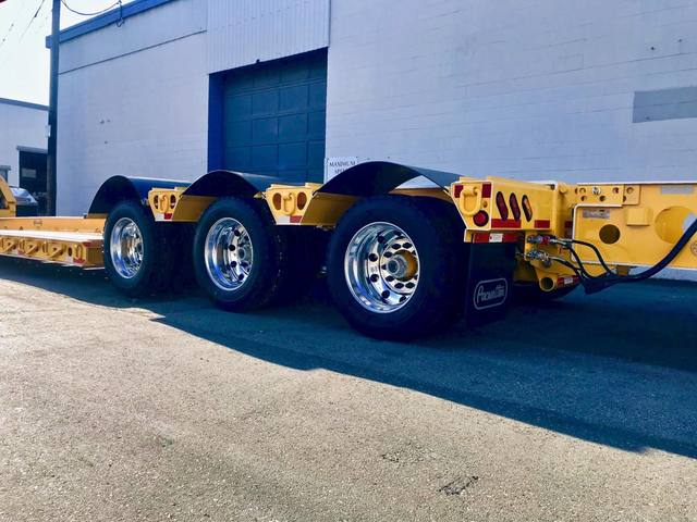 Yellow 60 ton lowbed with black fenders and a pin-on booster at the Pacesetter yard, photo 6 of 11