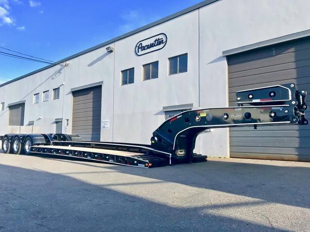 Black 65 ton lowbed with full fenders and white pinstripe edging on a sunny day, photo 2 of 7