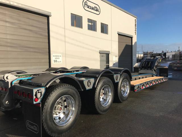 Charcoal 75 ton lowbed with light blue pinstriping and its two axle nitrogen booster, photo 12 of 26