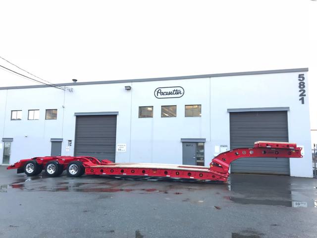 Red 75 ton lowbed with folding rear ramps at the Pacesetter yard, photo 2 of 12