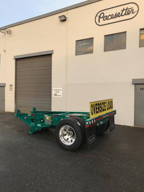 Green single axle fish mouth booster with raised coupling arms at the Pacesetter yard, photo 3 of 9