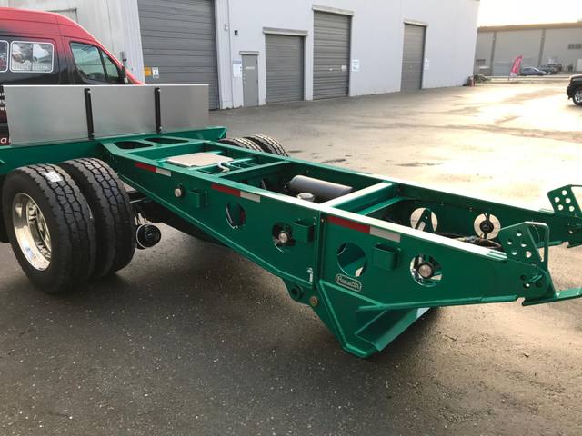 Green single axle fish mouth booster with raised coupling arms at the Pacesetter yard, photo 6 of 9