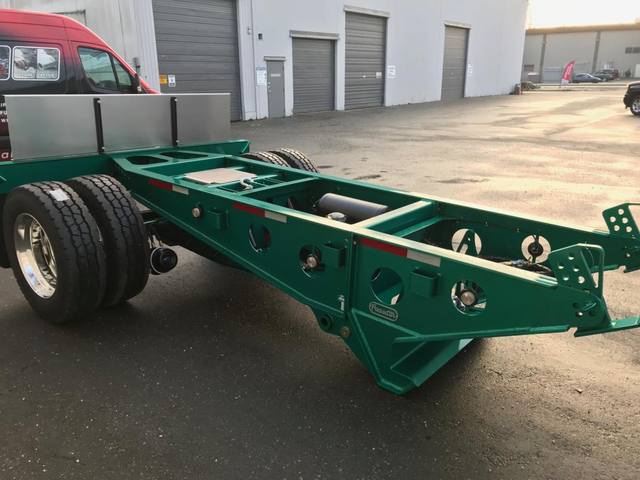 Green single axle fish mouth booster with raised coupling arms at the Pacesetter yard, photo 7 of 9
